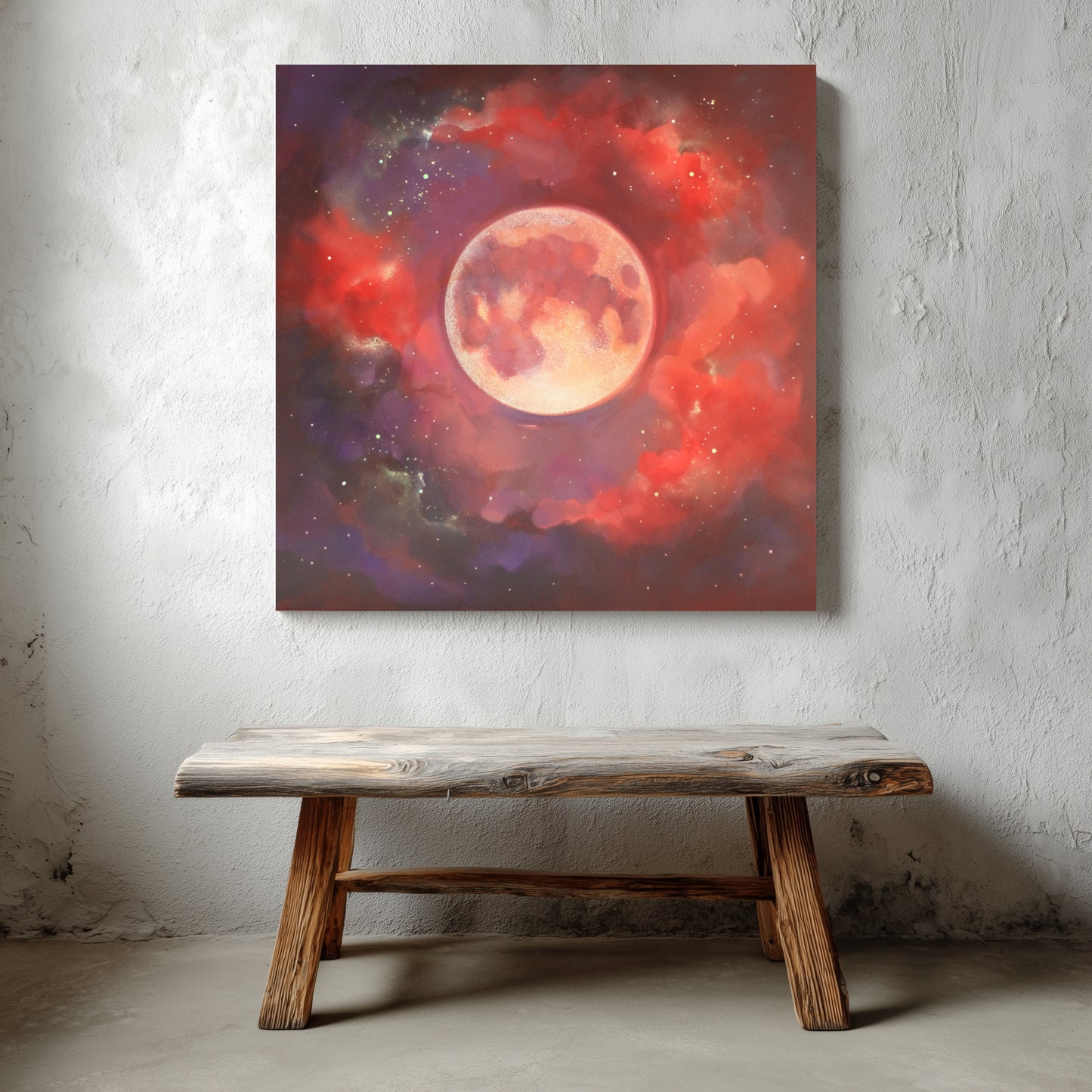 Canvas painting of a celestial scene with a large moon and red glowing clouds on a textured wall above a wooden bench.