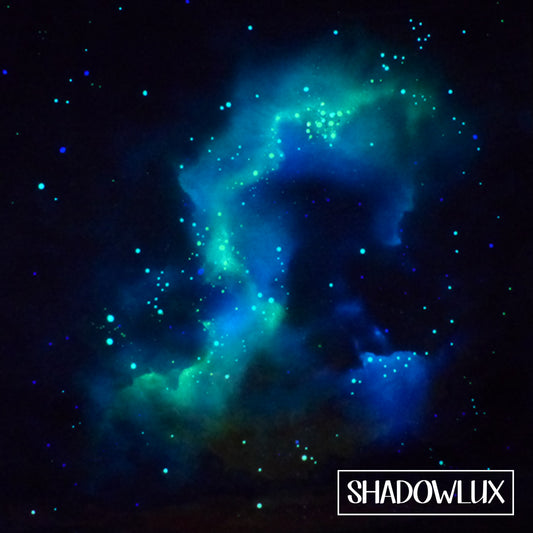glow in the dark painting at night, with an aqua coloured nebula