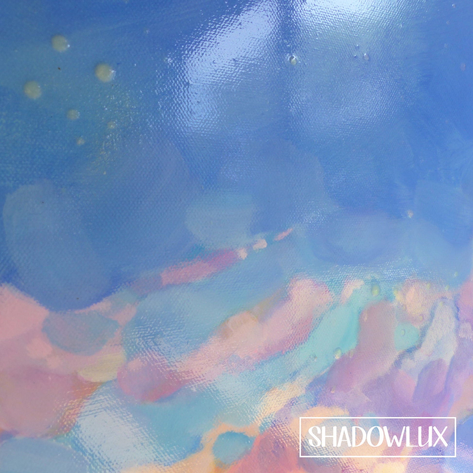 extreme closeup of glow in the dark blue sky painting