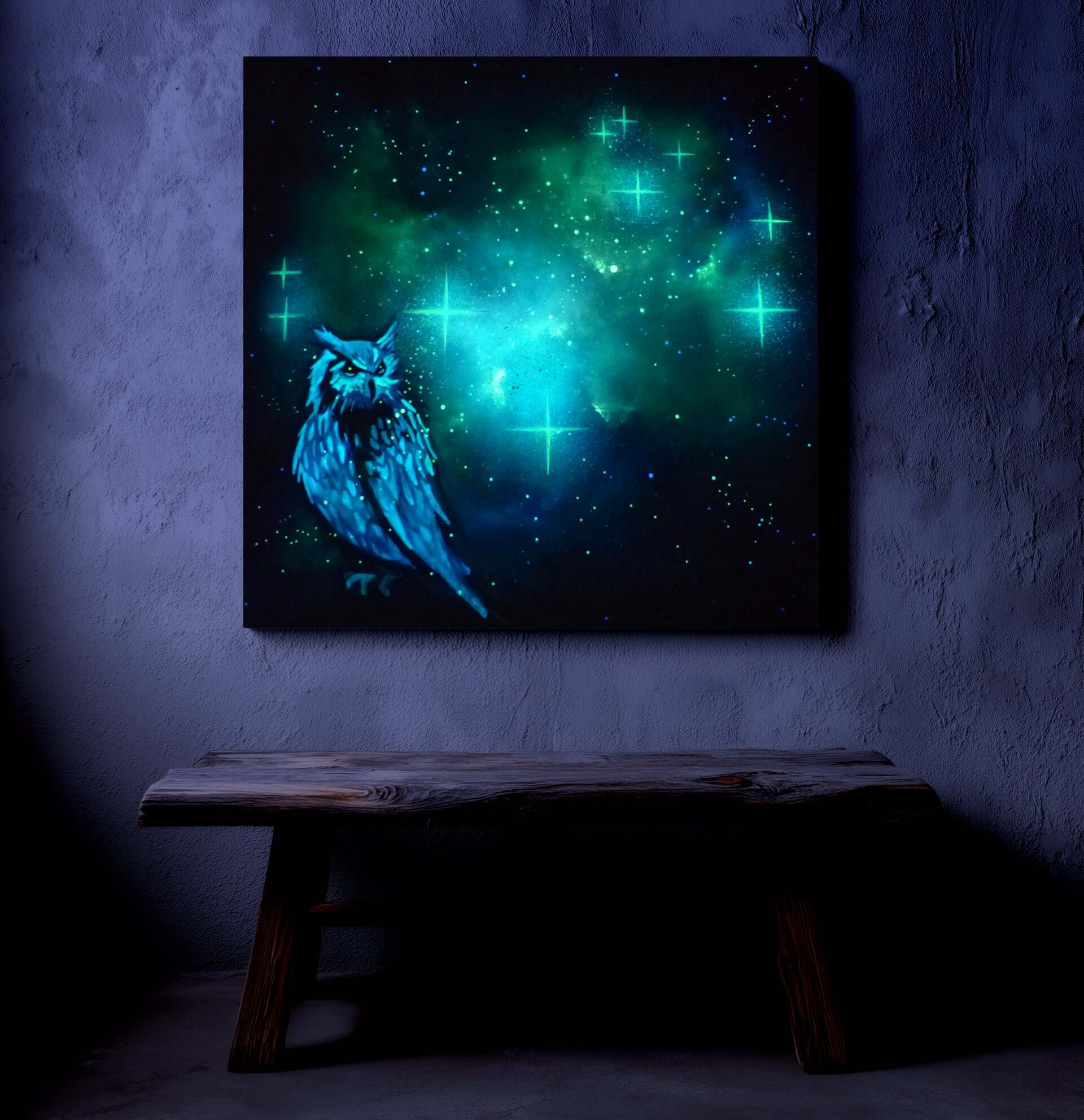 glow in the dark owl artwork with glowing green and blue hues on a dark wall.