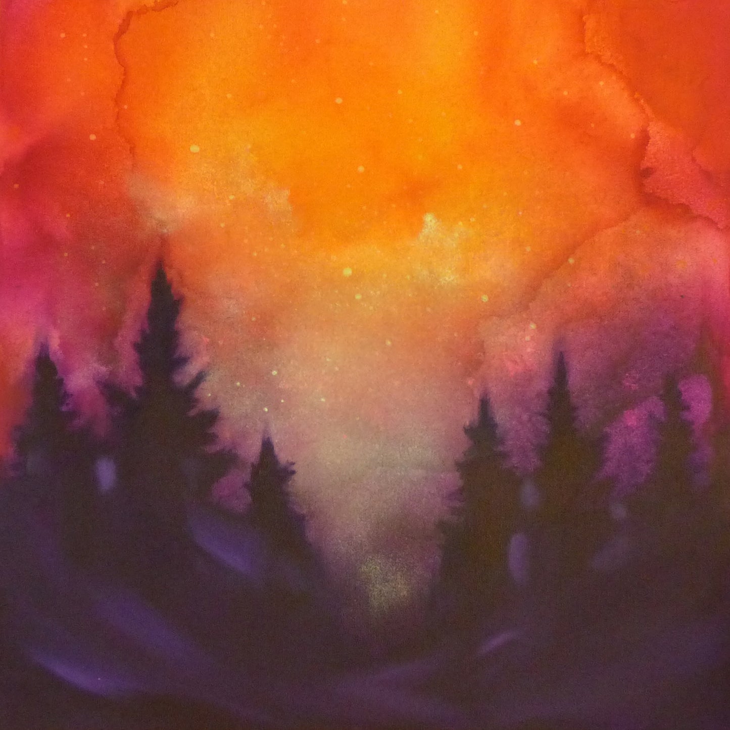 Colorful glow in the dark painting with silhouettes of trees