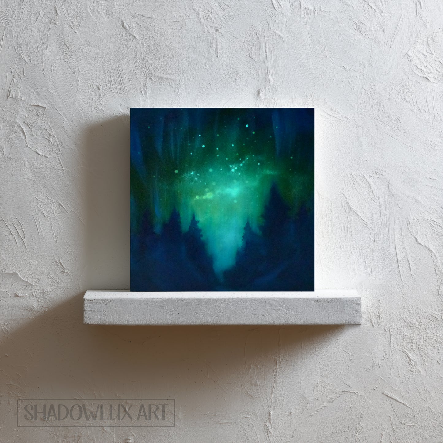 glow in the dark artwork of a celestial scene with green and blue hues on a white wall.