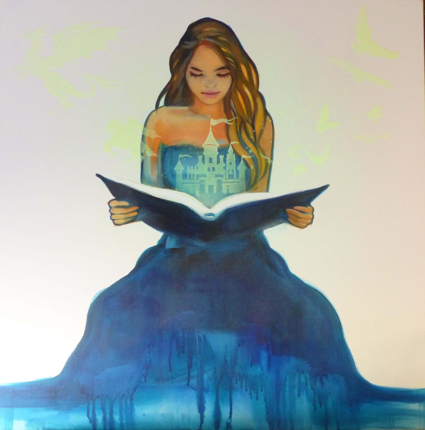 glow in the dark painting of a woman in a blue dress holding an open book with a castle illustration.