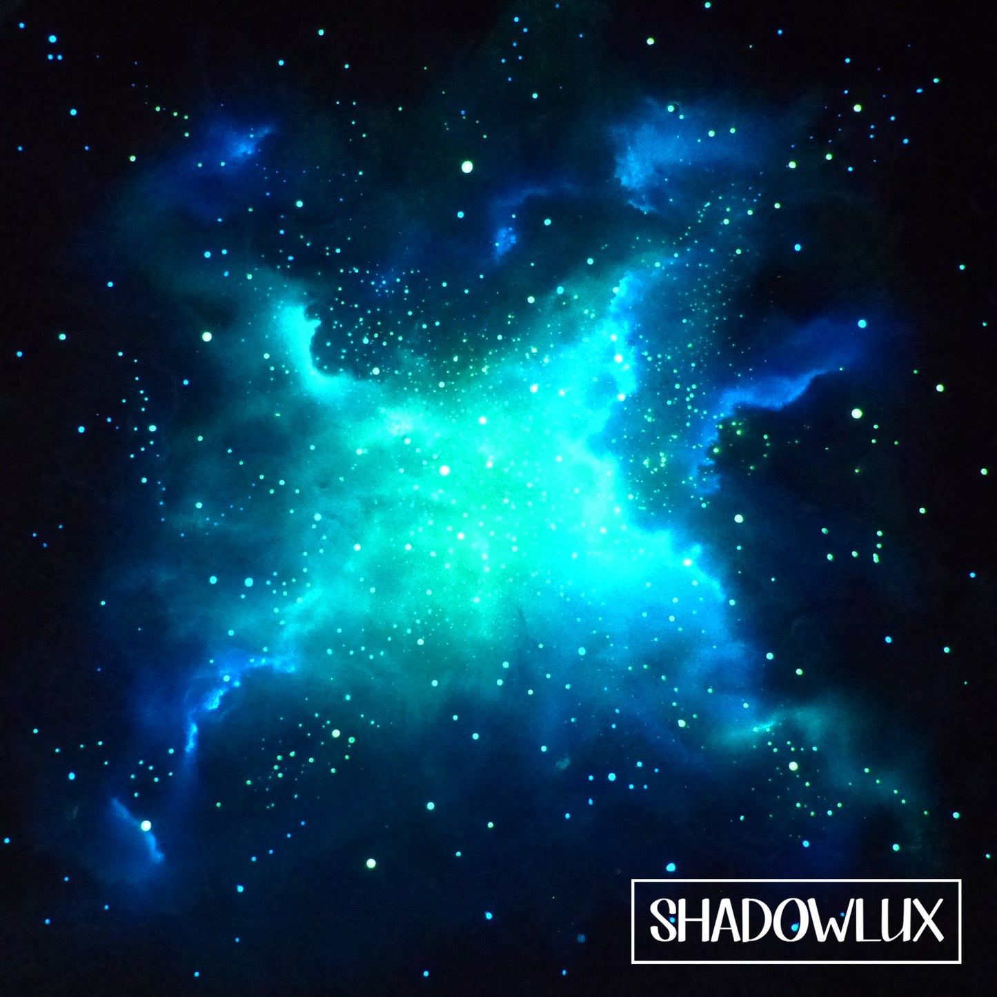 glowing artwork of blue and green Nebula with 'Shadowlux' branding in the corner