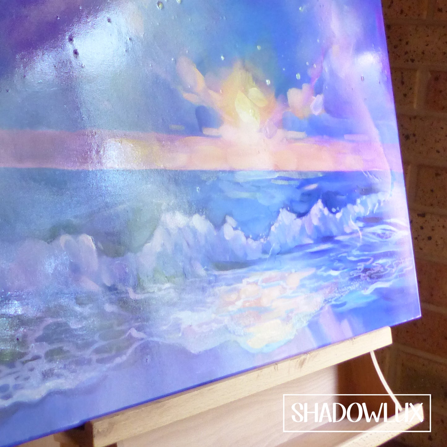 closeup of the glow in the dark beach painting showing waves