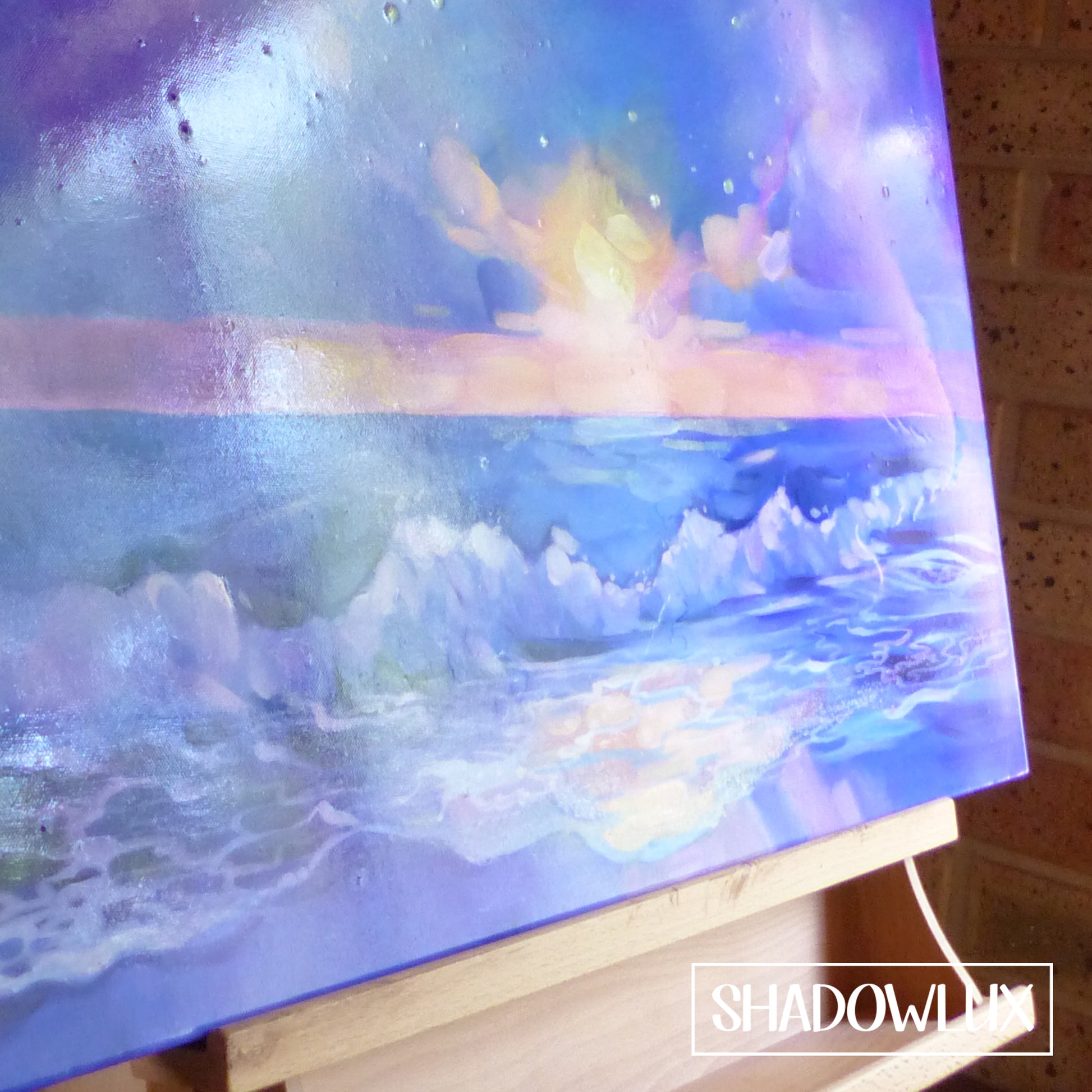 closeup of the glow in the dark beach painting showing waves