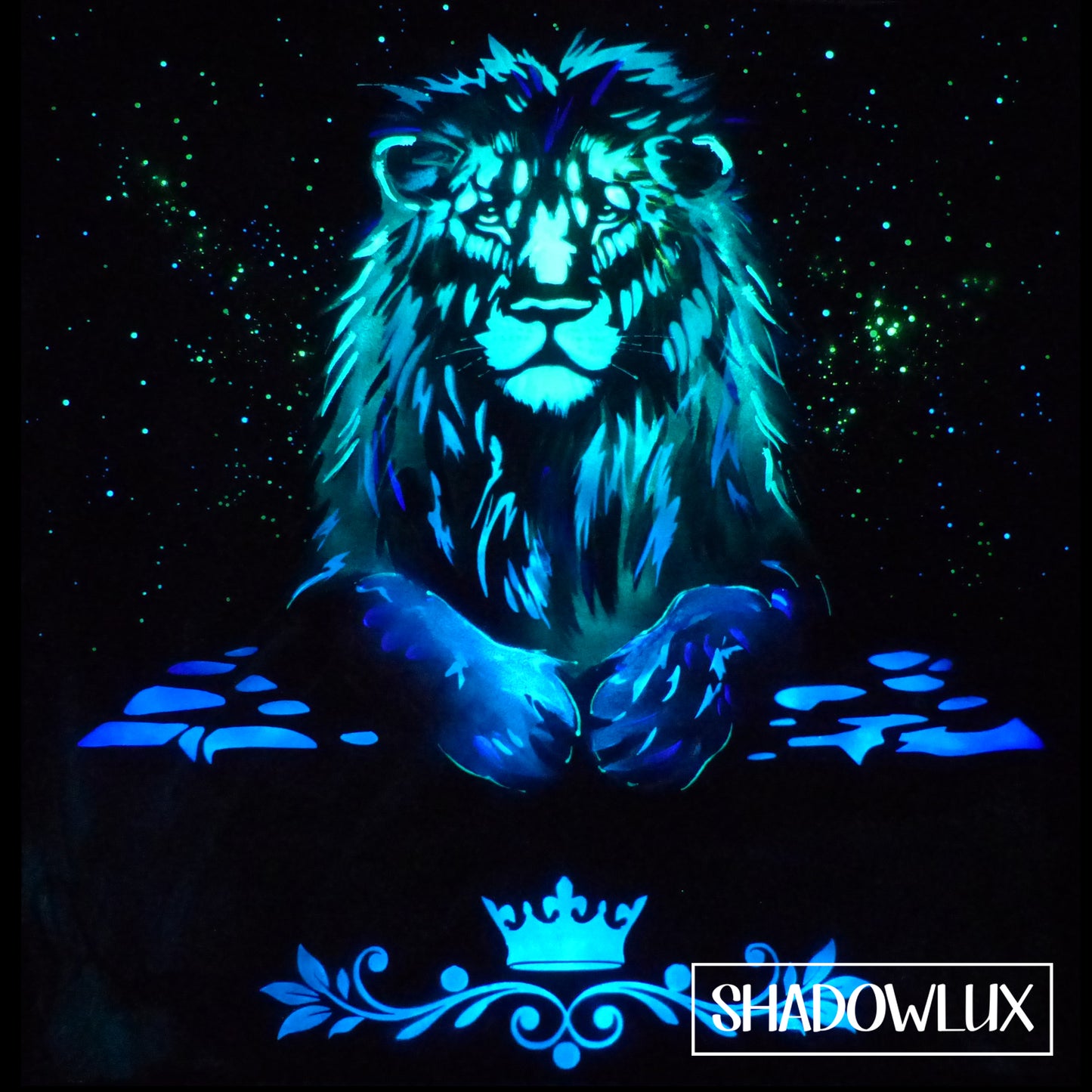 glow in the dark lion painting with glow stars and crown decorative detail on a stone table