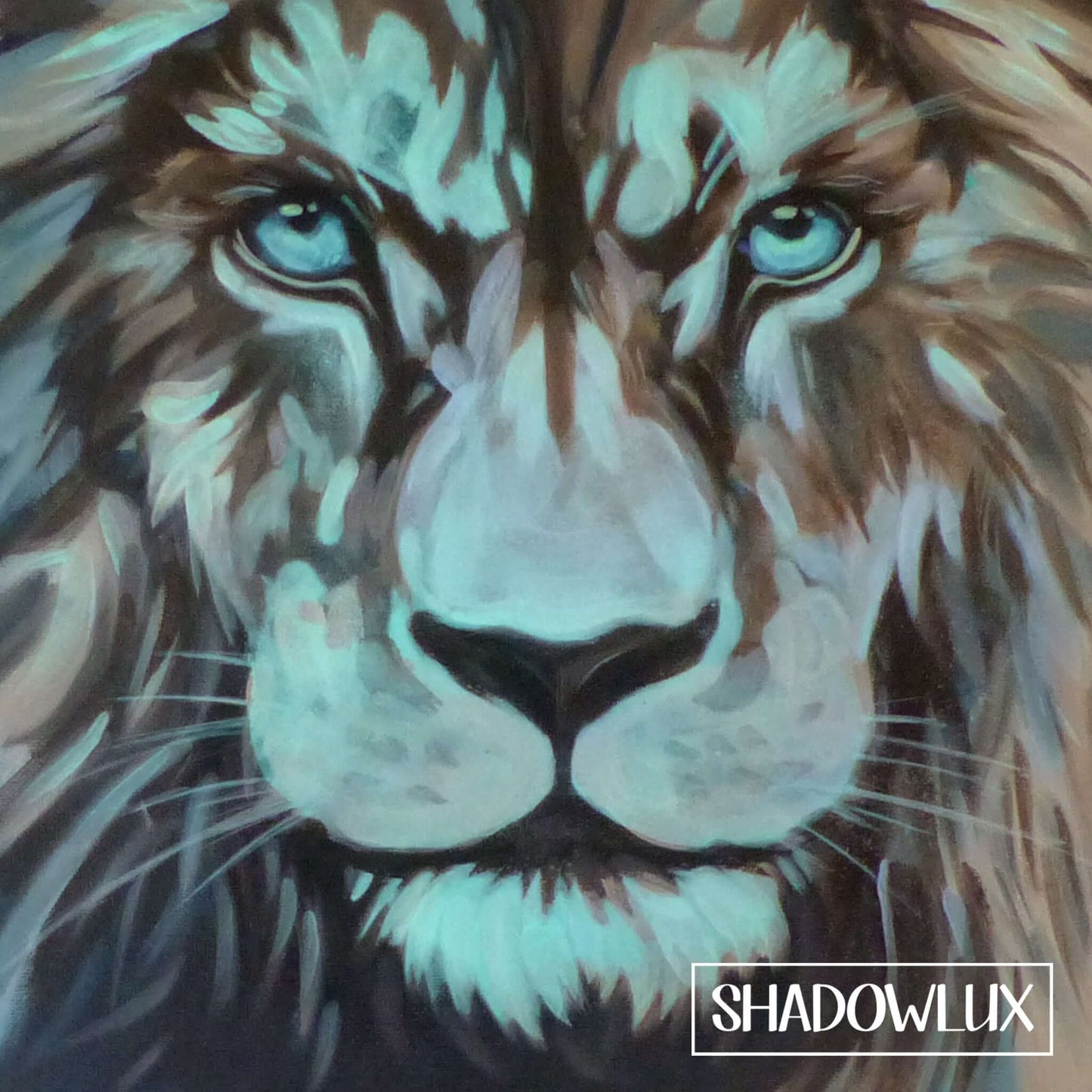 Close-up glow in the dark painting of a lion’s head with warm tones and blue highlights