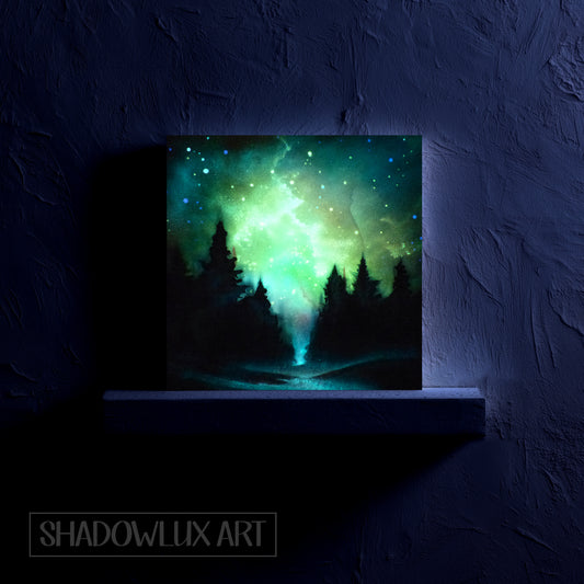 glow in the dark nebula artwork of a forest with a glowing green nebula effect on a dark wall.