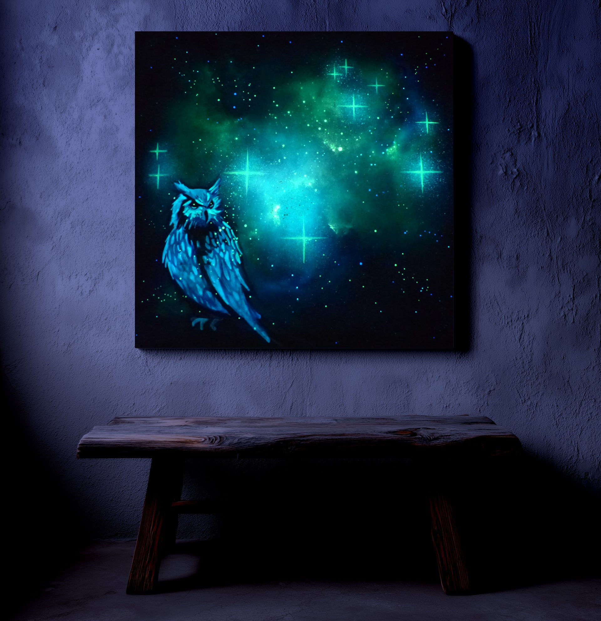 glow in the dark owl artwork with glowing green and blue hues on a dark wall.