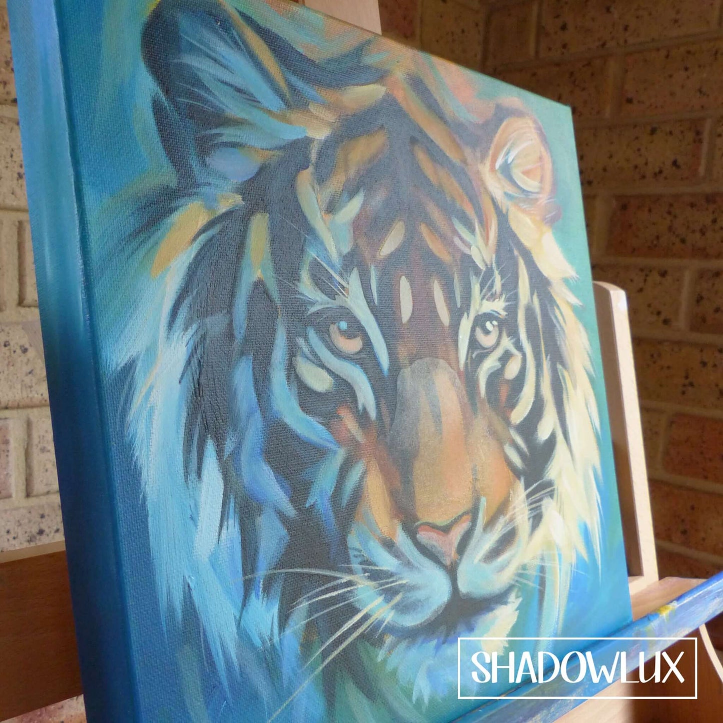 Glow in the dark animal wall canvas featuring a tiger's close up face