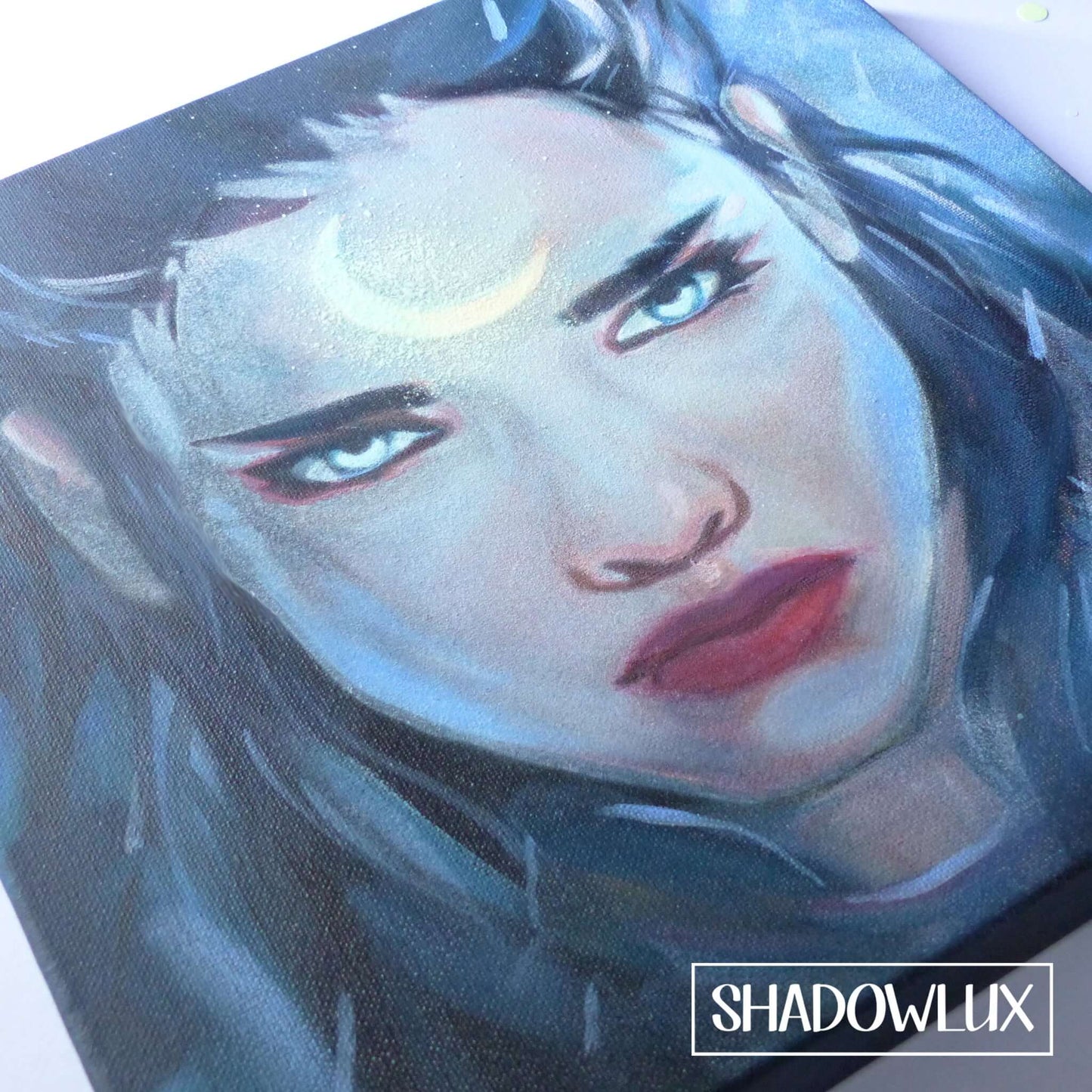 Glow in the dark painting of an elf warrior girl with a glowing crescent moon tattoo